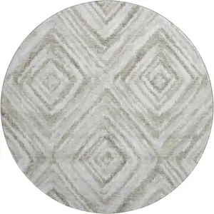 Photo of 8' Beige Gray And Ivory Geometric Washable Round Rug With UV Protection