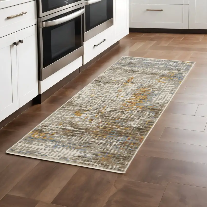 8' Beige Grey Brown Gold Red And Blue Abstract Power Loom Runner Rug With Fringe Photo 1