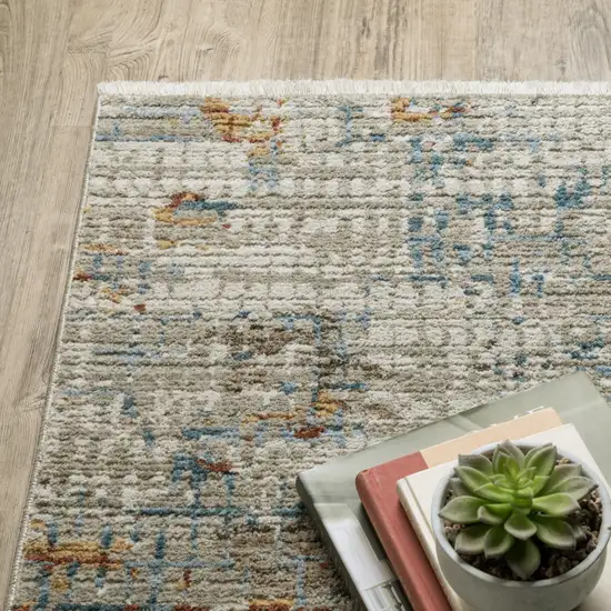 8' Beige Grey Brown Gold Red And Blue Abstract Power Loom Runner Rug With Fringe Photo 7