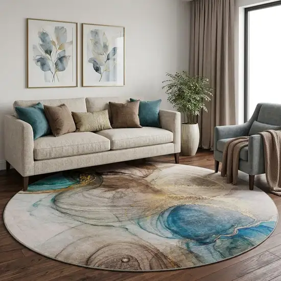 8' Beige Ivory And Blue Abstract Washable Round Rug With UV Protection Photo 1