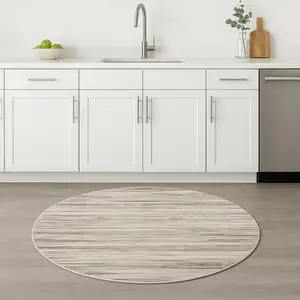 Photo of 4' Beige Ivory And Brown Abstract Distressed Round Rug