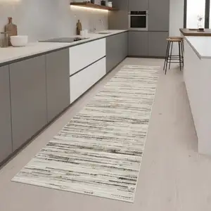 Photo of 8' Beige Ivory And Brown Abstract Distressed Runner Rug