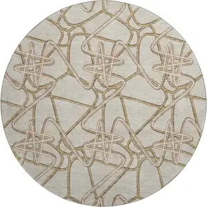 Photo of 8' Beige Ivory And Brown Geometric Washable Round Rug With UV Protection