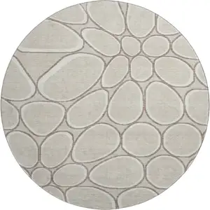 Photo of 8' Beige Ivory And Brown Geometric Washable Round Rug With UV Protection