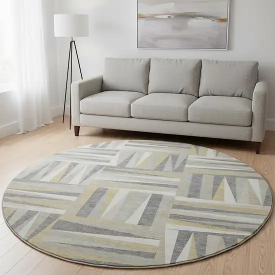 8' Beige Ivory And Gold Geometric Washable Round Rug With UV Protection Photo 2