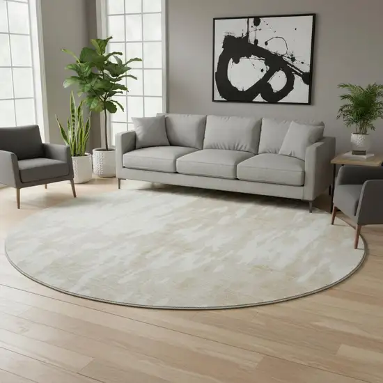 8' Beige Ivory And Tan Abstract Washable Round Rug With UV Protection Photo 2