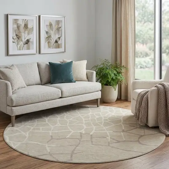 8' Beige Ivory And Taupe Abstract Geometric Washable Round Rug With UV Protection Photo 1