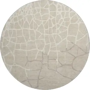 Photo of 8' Beige Ivory And Taupe Abstract Geometric Washable Round Rug With UV Protection