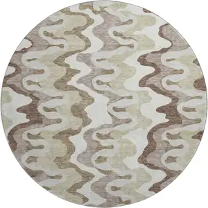Photo of 8' Beige Ivory And Taupe Abstract Washable Round Rug With UV Protection