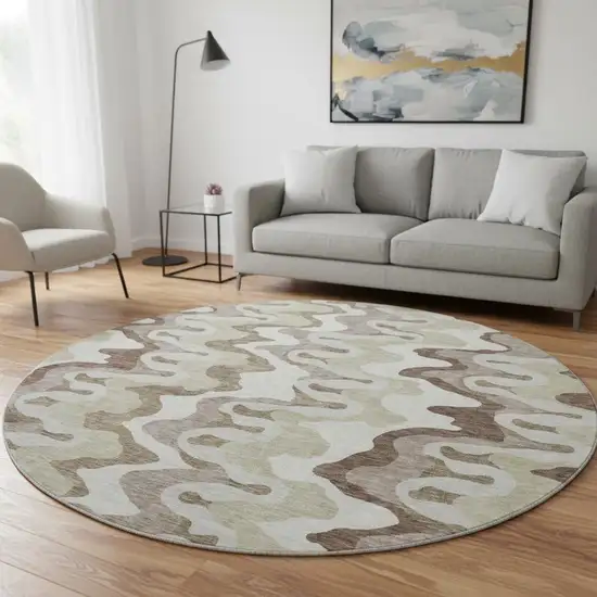 8' Beige Ivory And Taupe Abstract Washable Round Rug With UV Protection Photo 2
