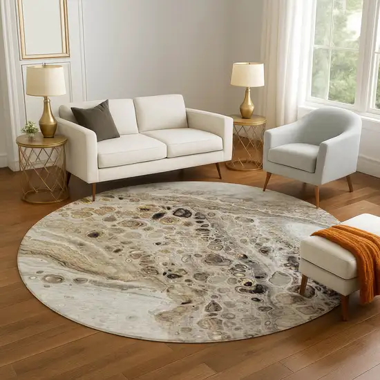 8' Beige Ivory And Taupe Abstract Washable Round Rug With UV Protection Photo 5