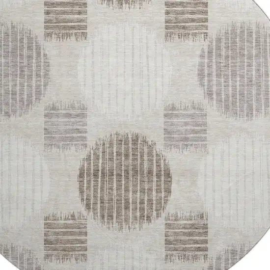 8' Beige Ivory And Taupe Geometric Washable Round Rug With UV Protection Photo 3