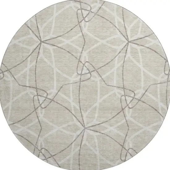 8' Beige Ivory And Taupe Geometric Washable Round Rug With UV Protection Photo 3