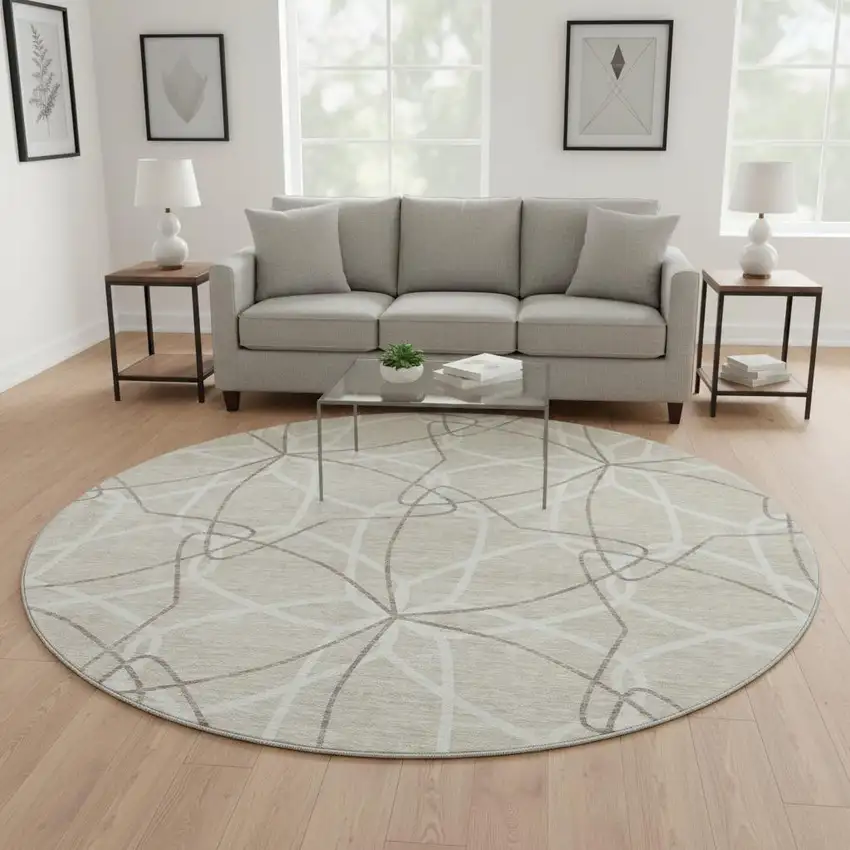 8' Beige Ivory And Taupe Geometric Washable Round Rug With UV Protection Photo 2