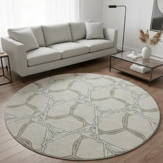 8' Beige Ivory And Taupe Geometric Washable Round Rug With UV Protection Photo 2