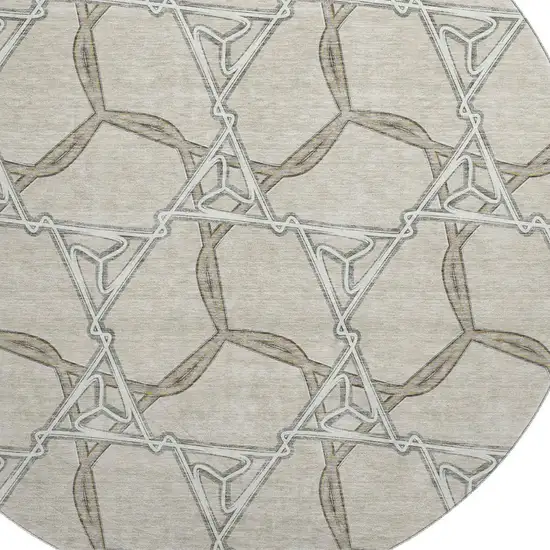 8' Beige Ivory And Taupe Geometric Washable Round Rug With UV Protection Photo 2