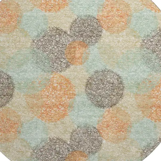 8' Beige Orange And Ivory Abstract Washable Round Rug With UV Protection Photo 2
