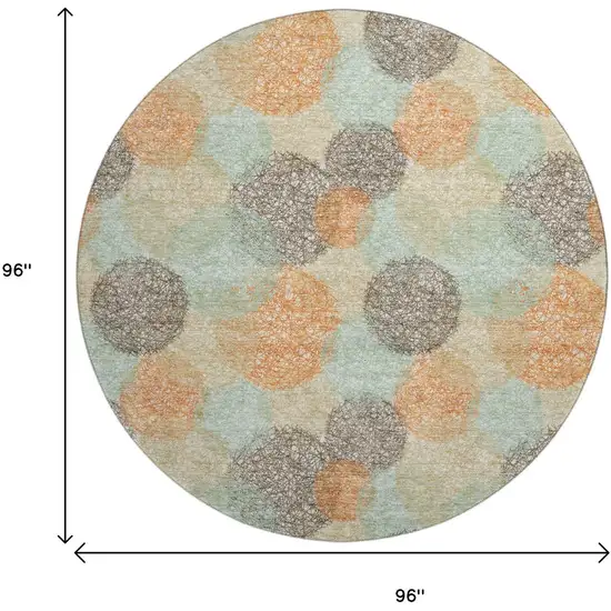 8' Beige Orange And Ivory Abstract Washable Round Rug With UV Protection Photo 9