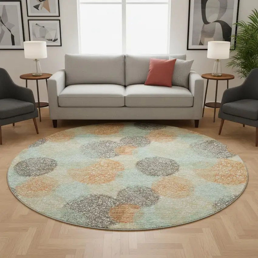 8' Beige Orange And Ivory Abstract Washable Round Rug With UV Protection Photo 2