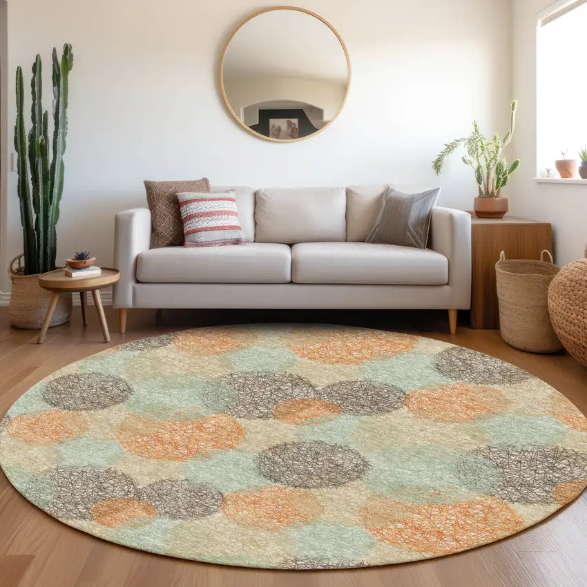 8' Beige Orange And Ivory Abstract Washable Round Rug With UV Protection Photo 4