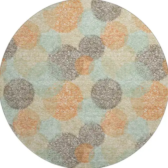 8' Beige Orange And Ivory Abstract Washable Round Rug With UV Protection Photo 3