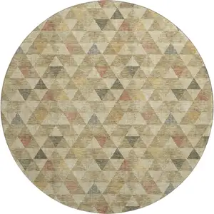 Photo of 8' Beige Red And Salmon Geometric Washable Round Rug With UV Protection