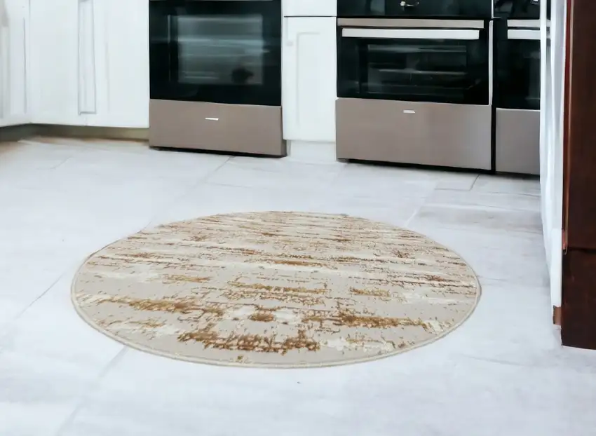 4' Beige Round Abstract Washable Non Skid Area Rug With Fringe Photo 1