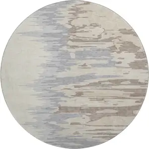 Photo of 8' Beige Silver And Gray Abstract Washable Round Rug With UV Protection