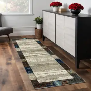 Photo of 8' Beige Tan And Dark Blue Patchwork Runner Rug