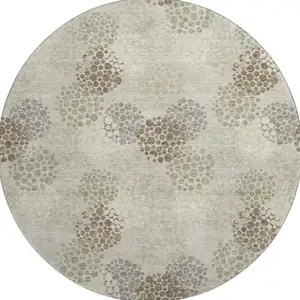 Photo of 8' Beige Tan And Ivory Polka Dot Washable Round Rug With UV Protection