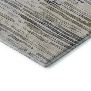 Photo of 8' Beige Tan And Silver Striped Washable Round Rug With UV Protection