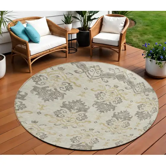 8' Beige Tan And Taupe Round Oriental Washable Indoor Outdoor Area Rug Photo 1