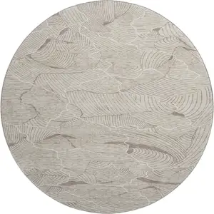 Photo of 8' Beige Taupe And Ivory Abstract Washable Round Rug With UV Protection