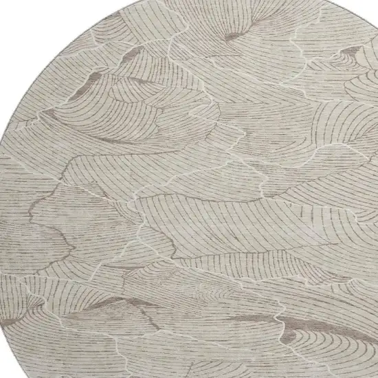 8' Beige Taupe And Ivory Abstract Washable Round Rug With UV Protection Photo 3