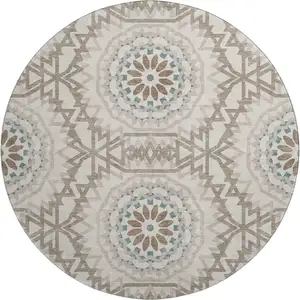 Photo of 8' Beige Teal And Brown Geometric Washable Round Rug With UV Protection