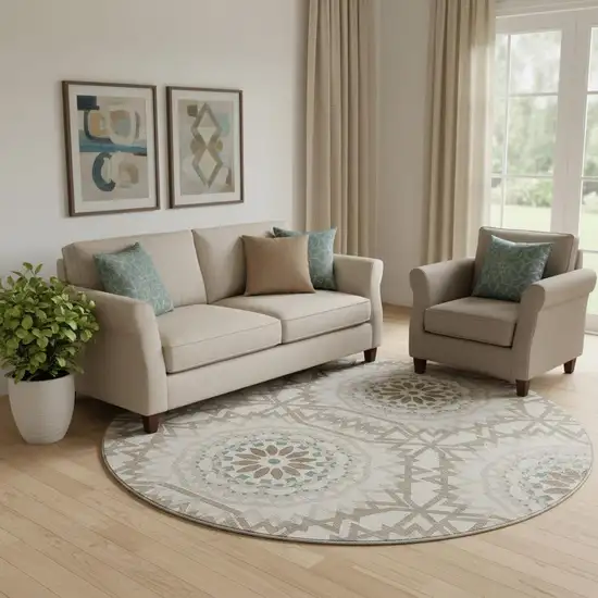 8' Beige Teal And Brown Geometric Washable Round Rug With UV Protection Photo 1