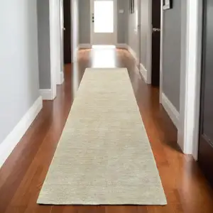 Photo of 8' Beige Wool Hand Tufted Runner Rug
