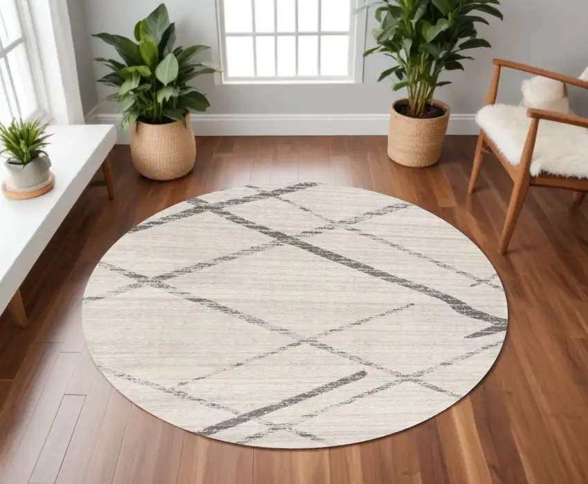 8' Beige and Gray Abstract Distressed Round Rug Photo 1