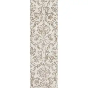 Photo of 7' Beige and Ivory Damask Distressed Runner Rug