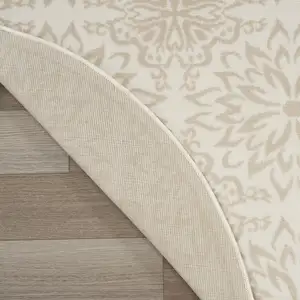 Photo of 5' Beige and Ivory Floral Non Skid Round Rug