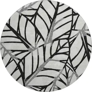 Photo of 8' Black And Beige Floral Washable Round Rug With UV Protection