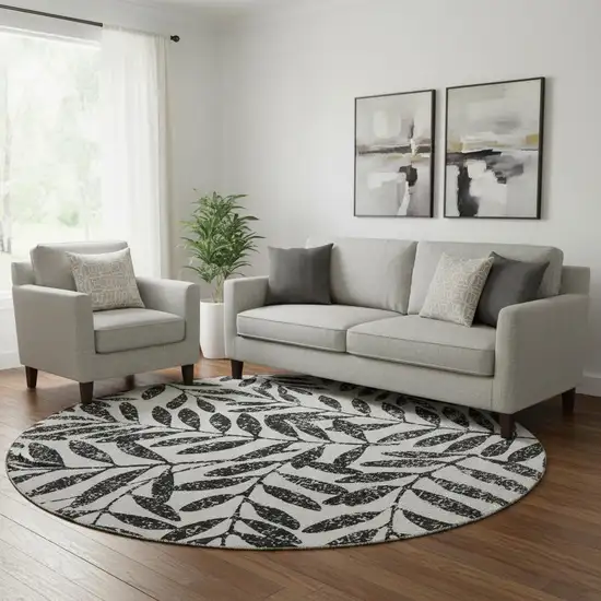 8' Black And Beige Floral Washable Round Rug With UV Protection Photo 1
