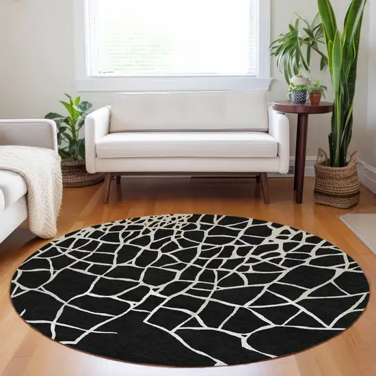8' Black And Beige Round Abstract Washable Indoor Outdoor Area Rug Photo 9