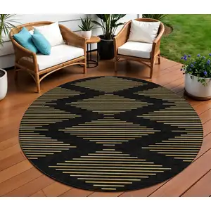 Photo of 8' Black And Beige Round Geometric Washable Indoor Outdoor Area Rug
