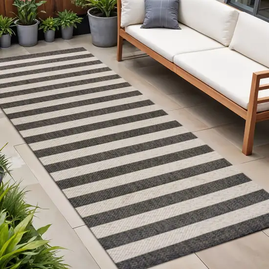 8' Black And Beige Striped Indoor Outdoor Runner Rug Photo 1