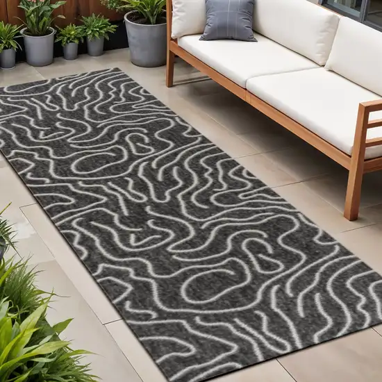 8' Black And Cream Abstract Indoor Outdoor Runner Rug Photo 1