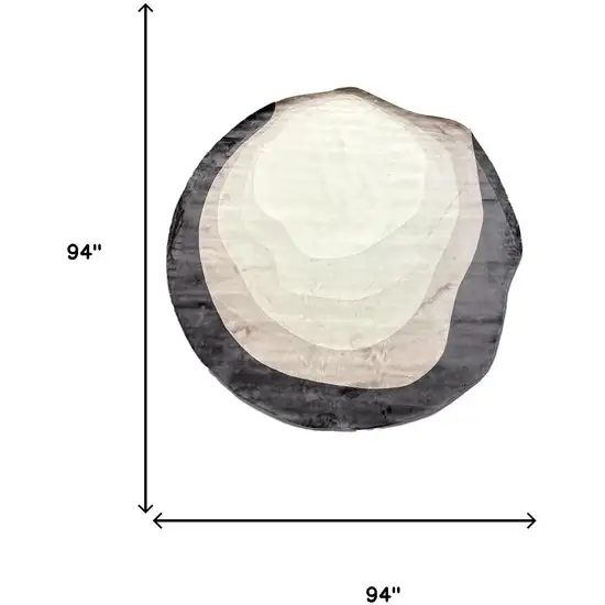 7' Black And Cream Abstract Round Rug Photo 6