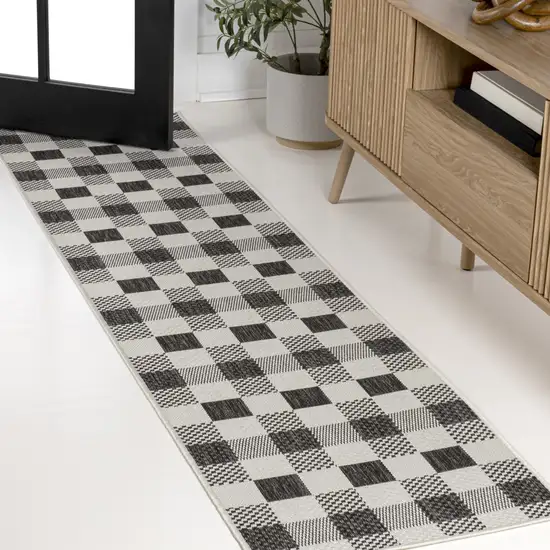 8' Black And Cream Geometric Indoor Outdoor Runner Rug Photo 4