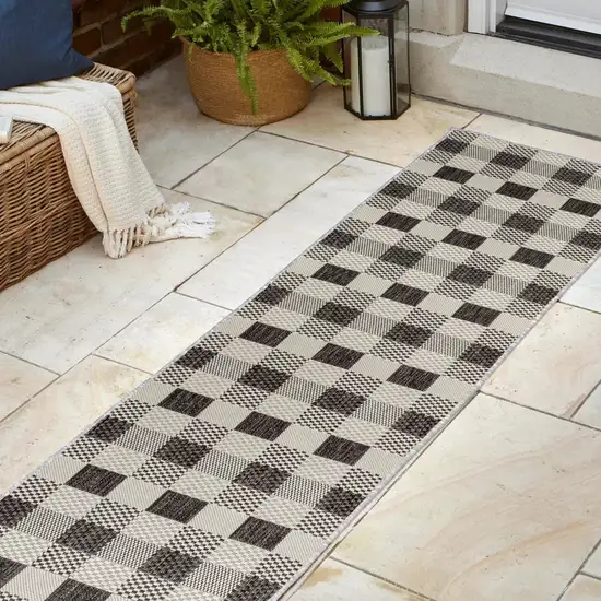 8' Black And Cream Geometric Indoor Outdoor Runner Rug Photo 5
