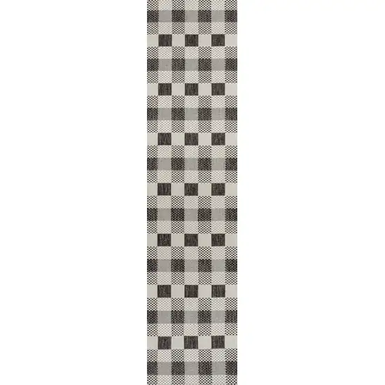 8' Black And Cream Geometric Indoor Outdoor Runner Rug Photo 1